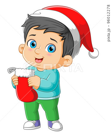 The happy boy is holding and hanging the big sock for the christmas gift  96012278