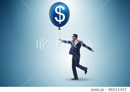 Businessman with dollar balloon concept 96015407
