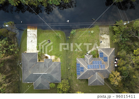 Surrounded by hurricane Ian rainfall flood waters homes in Florida residential area. Consequences of natural disaster Surrounded by hurricane Ian rainfall flood waters homes in Florida residential area. Consequences of natural disaster 96015411