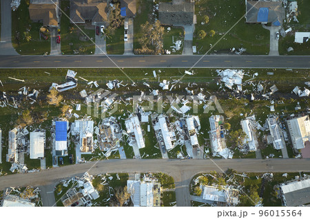 Hurricane Ian destroyed homes in Florida residential area. Natural disaster and its consequences 96015564