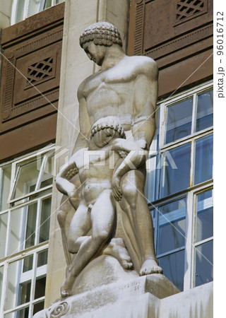 Care of the Sick or Healing sculpture on the facade of County Hall, London, UK. 96016712