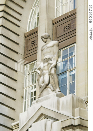 Care of the Sick or Healing sculptureon the facade of County Hall, London, UK. 96016719