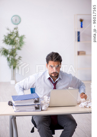 Young male employee in rejected ideas concept 96017565