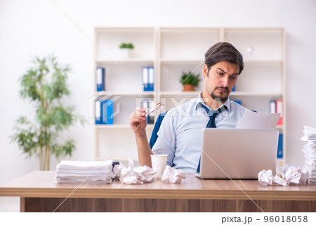 Young male employee rejecting new ideas in the office 96018058