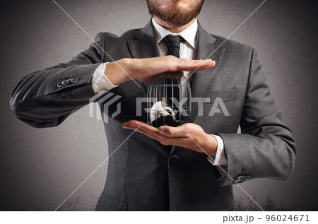 Caged businessman 96024671