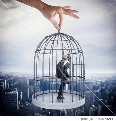 Caged businessman Caged businessman 96024694