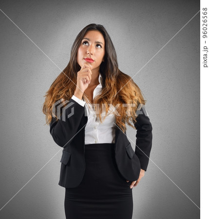 Reflective and thoughtful businesswoman 96026568