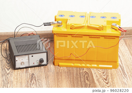 yellow car battery with car battery charger 96028220