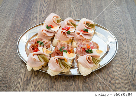 variation of bread with spread of cheese, ham, egg and vegetables variation of bread with spread of cheese, ham, egg and vegetables 96030294
