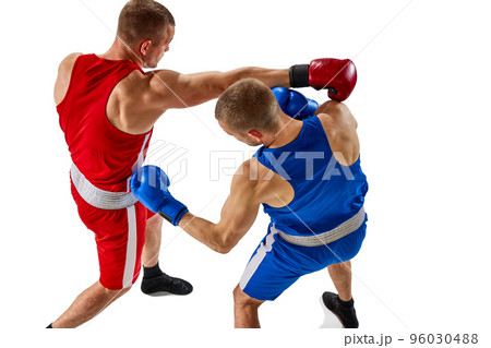 Aerial view of two muscular professional boxers in blue and red sportswear training isolated on white background. Professional sport 96030488