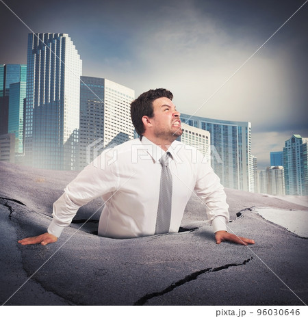 Businessman sinks into despair Businessman sinks into despair 96030646