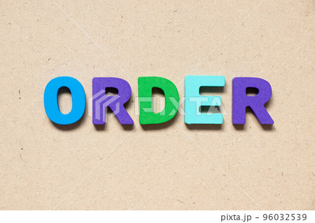 Color alphabet letter in word order on wood background 96032539