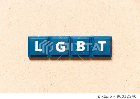 Tile letter in english word LGBT (Abbreviation of lesbian, gay, bisexual, and transgender) on wood background 96032540