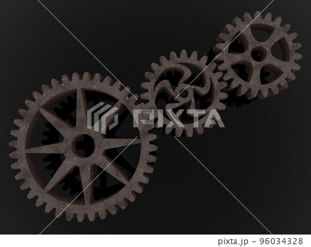 Three metal gears connected to each other on an asphalt background Three metal gears connected to each other on an asphalt background 96034328