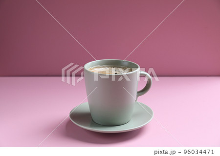 Black coffee white cup isolated on pink background Black coffee white cup isolated on pink background 96034471
