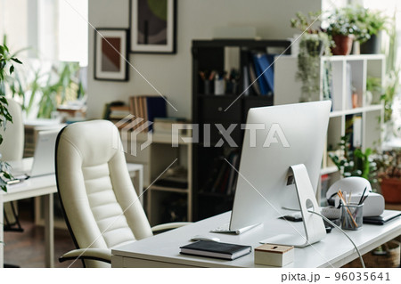 Computer monitor standing on workplace of office worker Computer monitor standing on workplace of office worker 96035641
