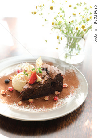 Chocolate cake with ice cream dessert on wood table Chocolate cake with ice cream dessert on wood table 96039635