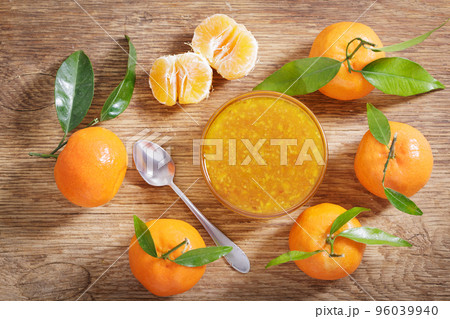 bowl of tangerine or mandarin jam with fresh fruits, top view bowl of tangerine or mandarin jam with fresh fruits, top view 96039940