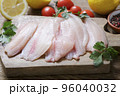 fresh fish fillet of tilapia with ingredients for cooking 96040032