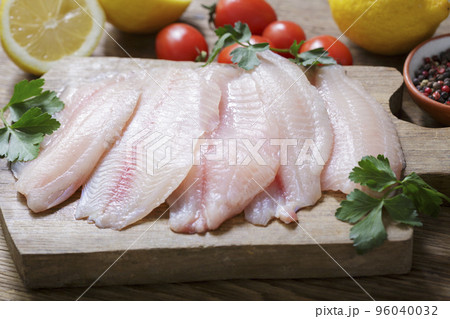 fresh fish fillet of tilapia with ingredients for cooking fresh fish fillet of tilapia with ingredients for cooking 96040032