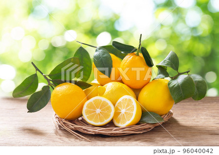 Fresh lemons on a wooden table 96040042