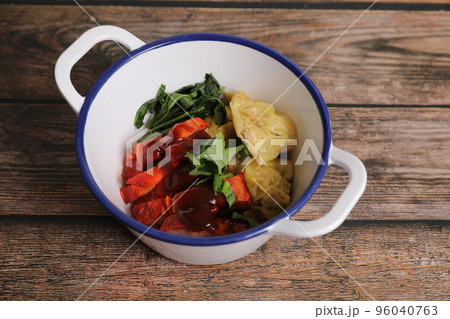 Shrimp dumpling with roasted pork on wood background Shrimp dumpling with roasted pork on wood background 96040763