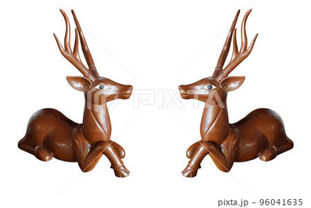 two wooden deers, old long horned wood deer sit and looking on white background, object, animal ,decor, gift, copy space 96041635