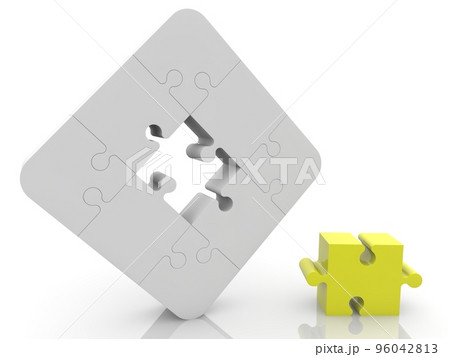 Unfinished white puzzle with a yellow puzzle in the foreground 96042813