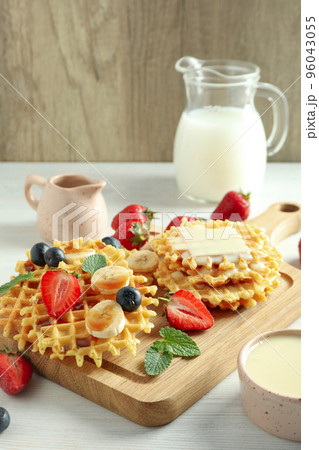 Concept of tasty food with wafers on white wooden table 96043055