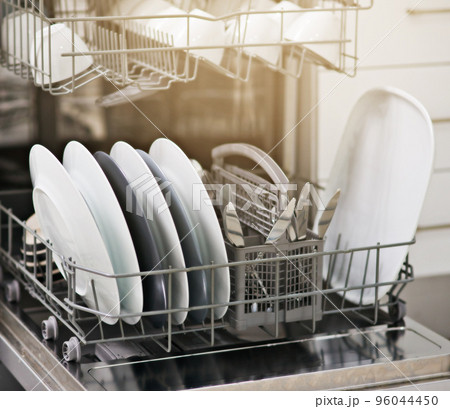 Dirty dishes no more. Shot of a dishwasher at home. 96044450