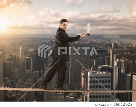 Equilibrist businessman 96052928
