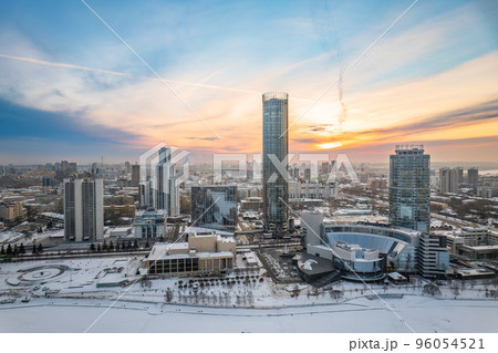 Yekaterinburg city with Buildings of Regional Government and Parliament, Dramatic Theatre, Iset Tower, Yeltsin Center, panoramic view at winter sunset. Yekaterinburg city with Buildings of Regional Government and Parliament, Dramatic Theatre, Iset Tower, Yeltsin Center, panoramic view at winter sunset. 96054521