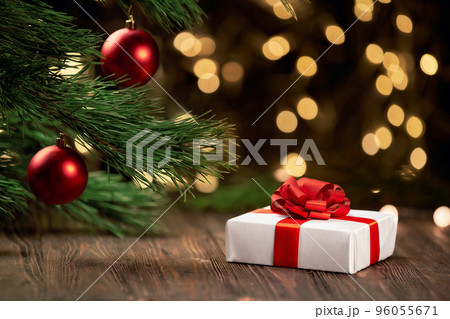 box with gifts on a festive Christmas background. 96055671