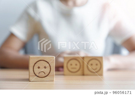 unhappy angry face from Emotion block. customer review, bad experience, negative feedback, satisfaction, survey, rating service, assessment, mood, world mental health day concept unhappy angry face from Emotion block. customer review, bad experience, negative feedback, satisfaction, survey, rating service, assessment, mood, world mental health day concept 96056171