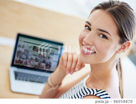 Design is in my blood. Portrait of a young office worker sitting at her workstation in an office. 96058870