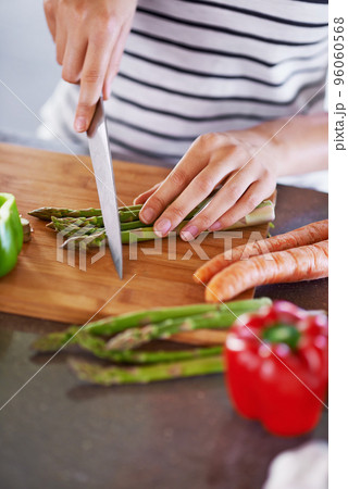 Ingredients for a great life. Cropped shot of a woman chopping vegetables. 96060568