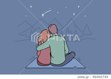 Happy couple hugging in mountains together  96060794
