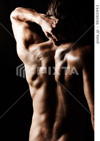 Masculinity in portrait. Studio shot of a muscular shirtless man isolated on black. 96060943
