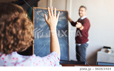 Dont be afraid to ask questions. Shot of an unrecognizable woman raising her hand to ask a question in a meeting. Dont be afraid to ask questions. Shot of an unrecognizable woman raising her hand to ask a question in a meeting. 96063484