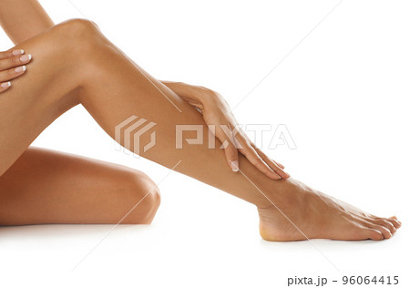 So soft and smooth. Studio shot of a young womans beautiful legs isolated on white. So soft and smooth. Studio shot of a young womans beautiful legs isolated on white. 96064415