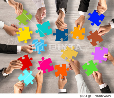 Teamwork and integration concept with puzzle pieces Teamwork and integration concept with puzzle pieces 96065889
