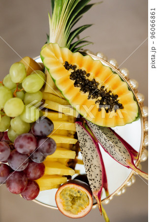 A variety of exotic fruits on a festive table for a banquet. A variety of exotic fruits on a festive table for a banquet. 96066861