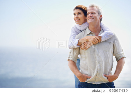 Looking forward to the future together. A happy mature couple with their heads together affectionately. Looking forward to the future together. A happy mature couple with their heads together affectionately. 96067459