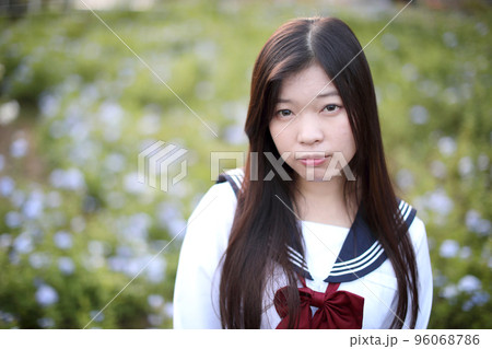 school girl costume at park outdoor with flowers garden background 96068786