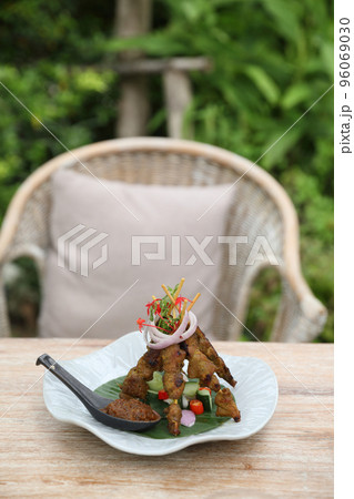 Chicken Satay on dark brown table street food appetizer 96069030