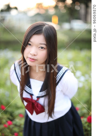 school girl costume at park outdoor with flowers garden background 96069870