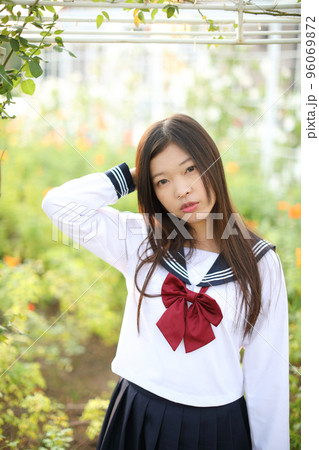 school girl costume at park outdoor with flowers garden background 96069872