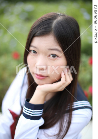 school girl costume at park outdoor with flowers garden background 96069873