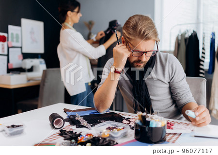 People desinging cloothes at workplace 96077117