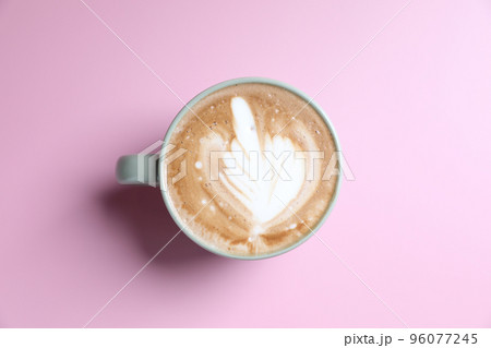 hot cappuccino with latte art isolated in pink background 96077245